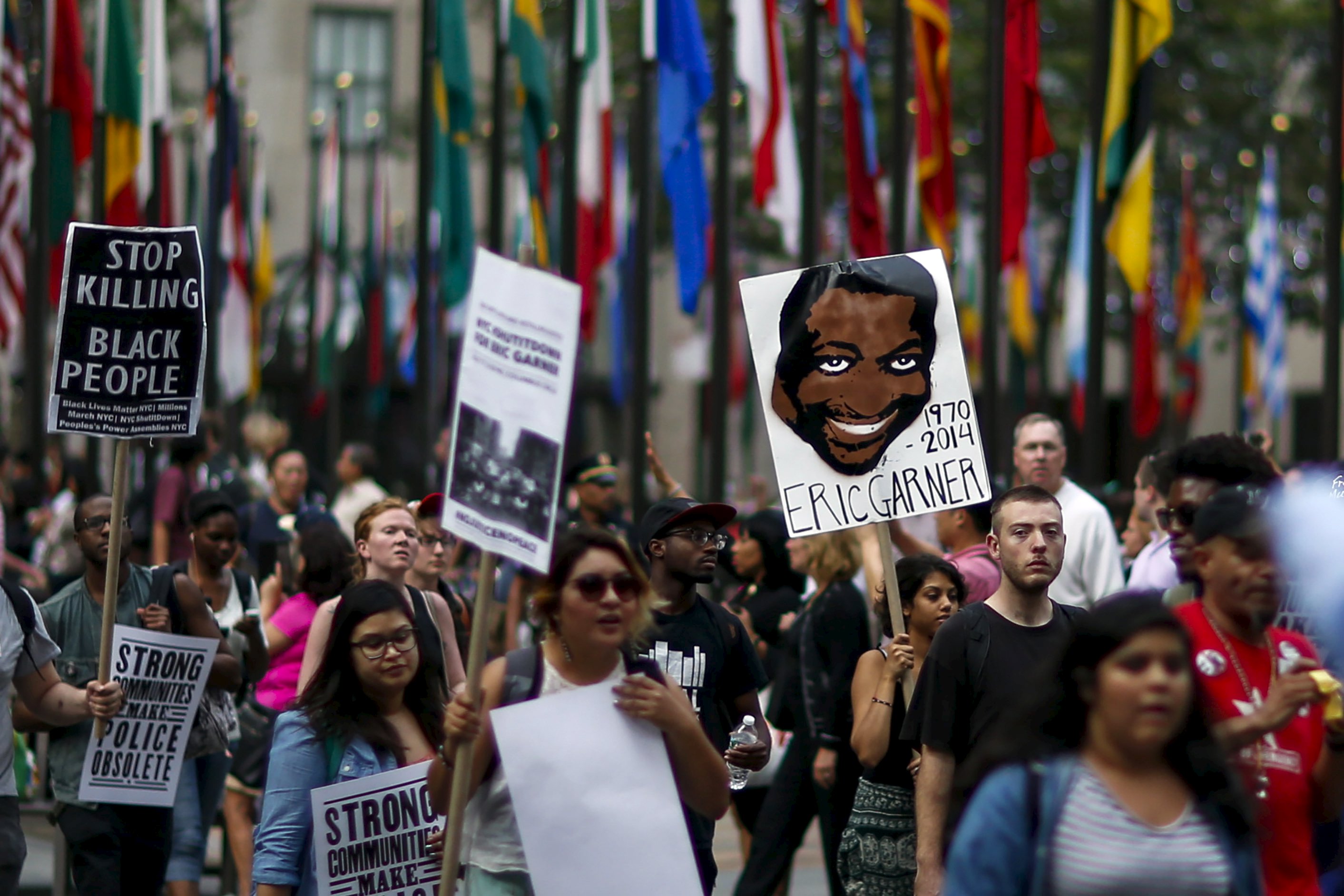 Protester march for Eric Garner who was killed one year ago by police in New York July 17, 2015. Family and supporters on Friday marked the anniversary of the police killing of Eric Garner with rallies and vigils demanding police reforms and justice in the controversial case. REUTERS/Eduardo Munoz